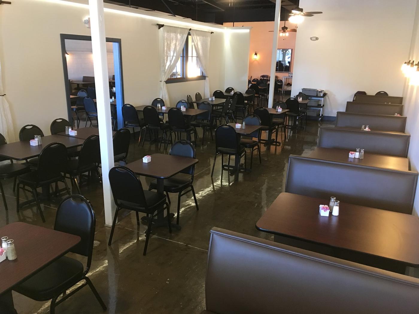 Mi Casa's second dining room, with dark booths, cream and apricot walls and polished floors